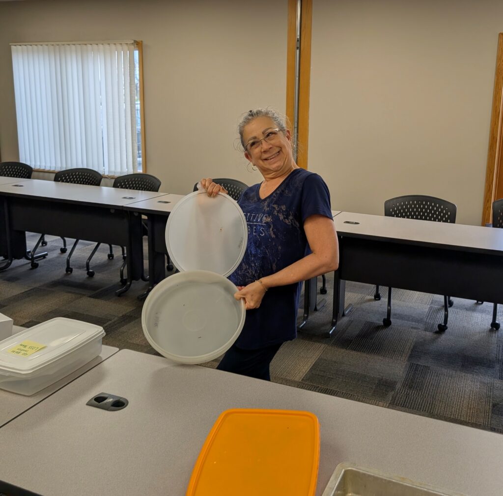 LOSS Team member showing an empty container