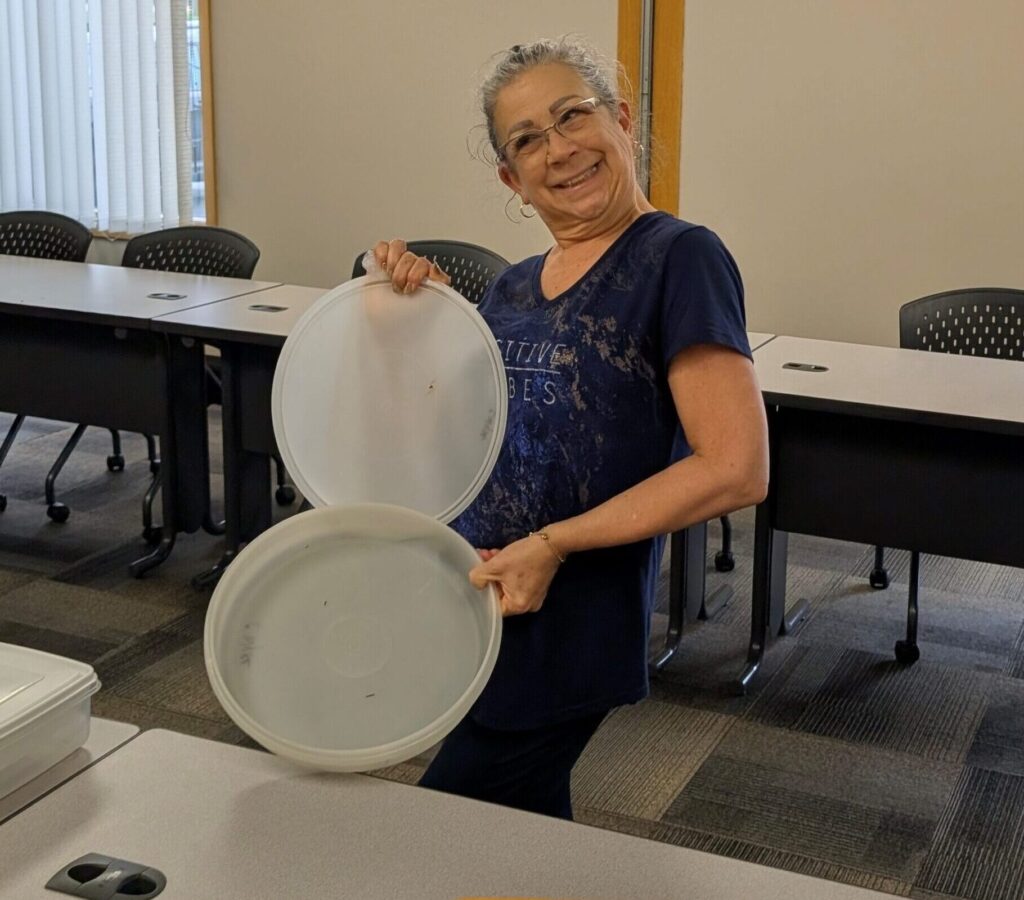 LOSS Team member showing an empty container