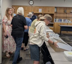 Members of the Four County LOSS Team packing up cookies.