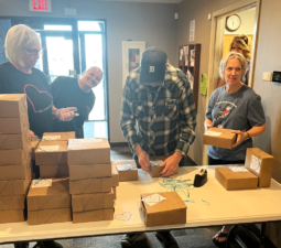 LOSS Team members tagging the cookie boxes